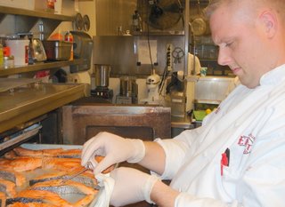 Chef Jeremy Anderson checks fish temp.JPG